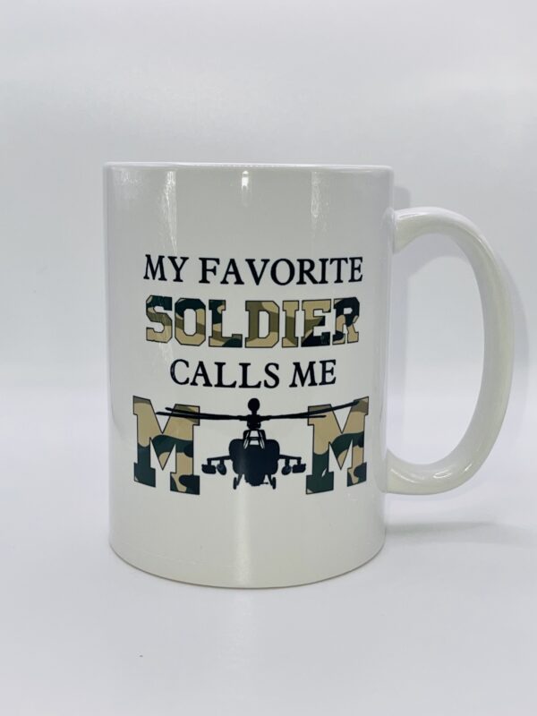 A white coffee mug with the words " my favorite soldier calls me mom ".