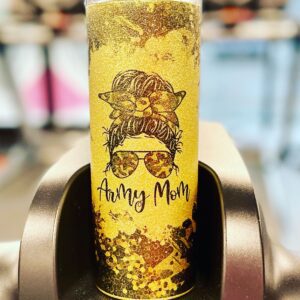 A yellow candle with an image of a woman wearing sunglasses.