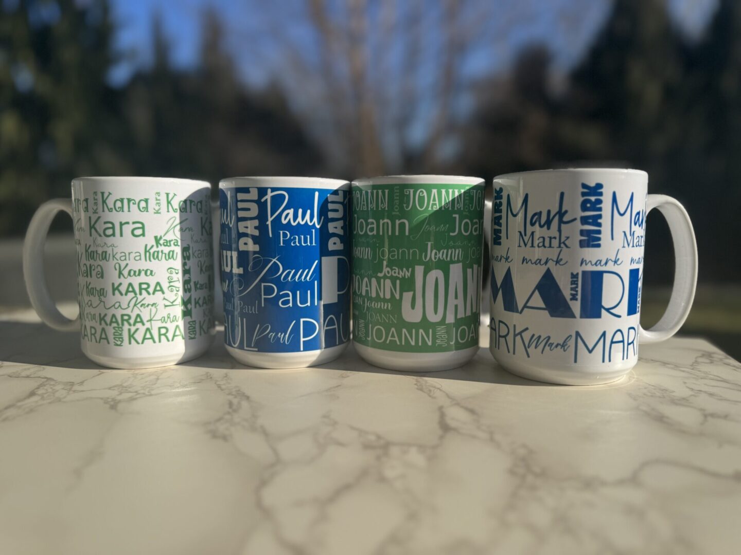 A picture of four different color cups with text on it